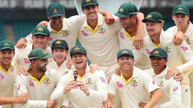 Australian captain Steve Smith holds a replica Ashes urn after Australia wrapped up the series with victory over England at the SCG on Monday.