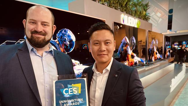 Hisense ANZ head of marketing Gideon Lui (right) and national appliance trainer Chris Mayer with the company's CES innovation award it received for its 110-inch TV.