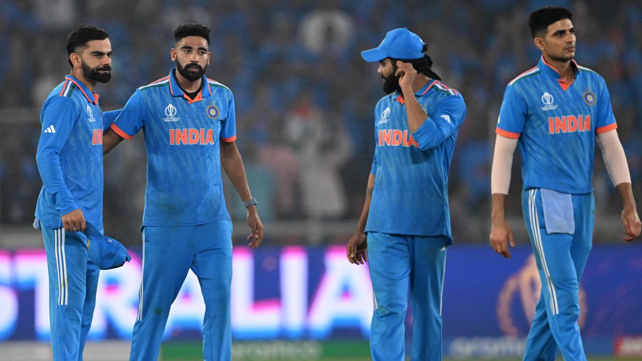 India's players react as they walk back to the pavilion. Photo by Punit PARANJPE / AFP.