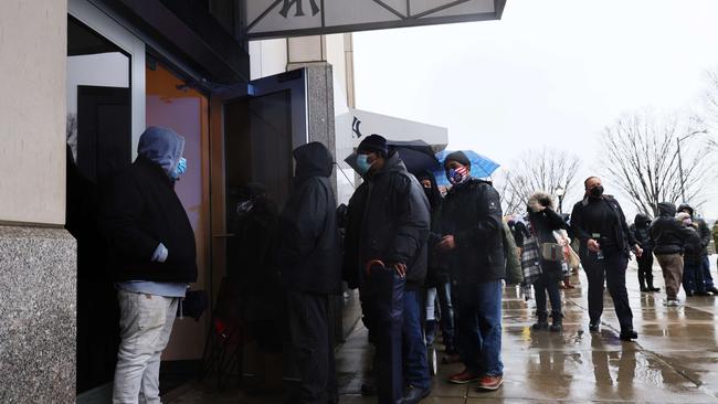 People wait in line to make an appointment for the coronavirus vaccination site at Yankee Stadium on Friday. Picture: Getty Images