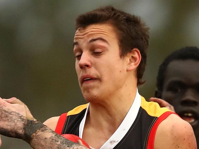 MELBOURNE, AUSTRALIA - JULY 07:  Matthew Gahan of the Stingrays is tackled during the round 11 TAC Cup match between Dandenong and Geelong at Shepley Oval on July 7, 2018 in Melbourne, Australia.  (Photo by Kelly Defina/AFL Media)