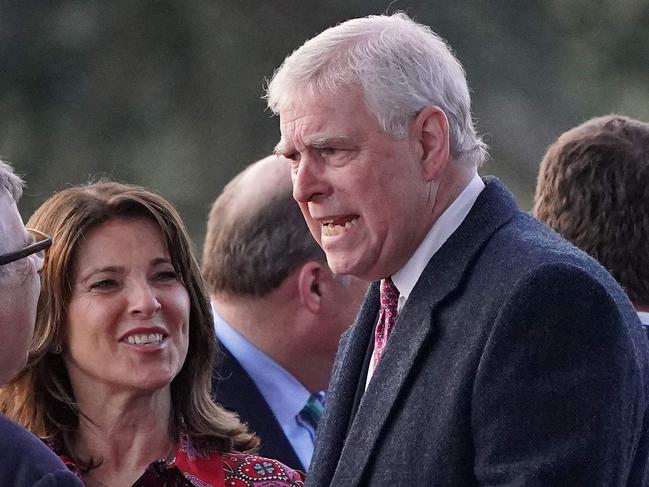 Britain's Prince Andrew, Duke of York (R) and Lindsay Wallace (L), partner of Peter Phillips (unseen) attend the Coronation Concert at Windsor Castle in Windsor, west of London on May 7, 2023. - For the first time ever, the East Terrace of Windsor Castle will host a spectacular live concert that will also be seen in over 100 countries around the world. The event will be attended by 20,000 members of the public from across the UK. (Photo by Jonathan Brady / POOL / AFP)