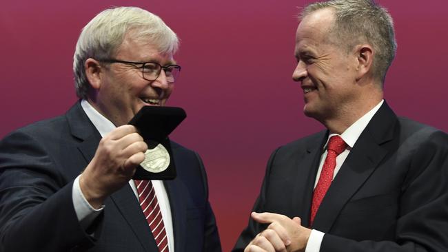 Kevin Rudd (is congratulated by Bill Shorten after receiving the Labor Life Membership during day three of the Labor Party National Conference in Adelaide. Picture: AAP Image/Lukas Coch