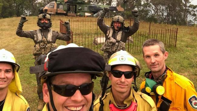 The Wilberforce Rural Fire Brigade with the Australian Navy MRH-90 Taipan crew, north of Bilpin.