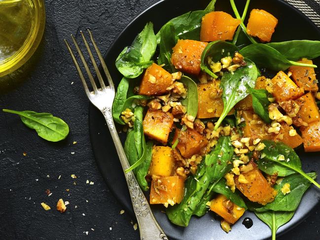 A vegan dish: Roasted pumpkin salad with spinach and walnut. Picture: istock