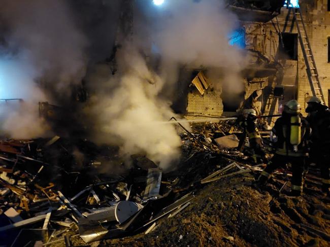 Firefighters extinguish a blaze at a damaged residential building at Koshytsa Street, a suburb of the Ukrainian capital Kyiv. Picture: AFP.