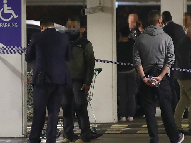 ****WARNING - IDENTITIES OF PLAIN CLOTHED OFFICERS SUPPRESSED- DO NOT PUBLISH WITHOUT BLURRING FACES OF PLAIN CLOTHED OFFICERS**** An AFP police officer was injured and fired a shot during a police operation in the carpark of Strathfield Plaza in Strathfield. Picture: Toby Zerna,