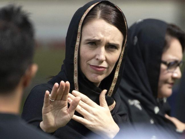 CORRECTION - New Zealand's Prime Minister Jacinda Ardern gestures as she departs following a gathering for congregational Friday prayers and two minutes of silence for victims of the twin mosque massacre, at Hagley Park in Christchurch on March 22, 2019. - Thousands of New Zealanders gathered in Christchurch on March 22 to honour the 50 Muslim worshippers killed one week ago by a white supremacist, with a call to prayer broadcast around the country and a two-minute silence. (Photo by Marty MELVILLE / AFP) / “The erroneous mention[s] appearing in the metadata of this photo by Marty MELVILLE has been modified in AFP systems in the following manner: [2019] instead of [2109]. Please immediately remove the erroneous mention[s] from all your online services and delete it (them) from your servers. If you have been authorized by AFP to distribute it (them) to third parties, please ensure that the same actions are carried out by them. Failure to promptly comply with these instructions will entail liability on your part for any continued or post notification usage. Therefore we thank you very much for all your attention and prompt action. We are sorry for the inconvenience this notification may cause and remain at your disposal for any further information you may require.”