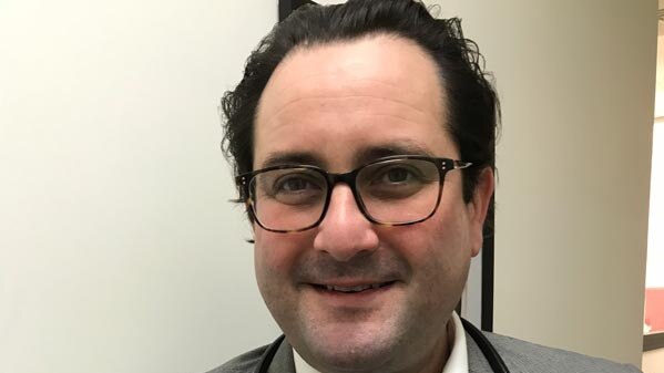 Bondi GP John Balafas was charged with domestic violence offences.