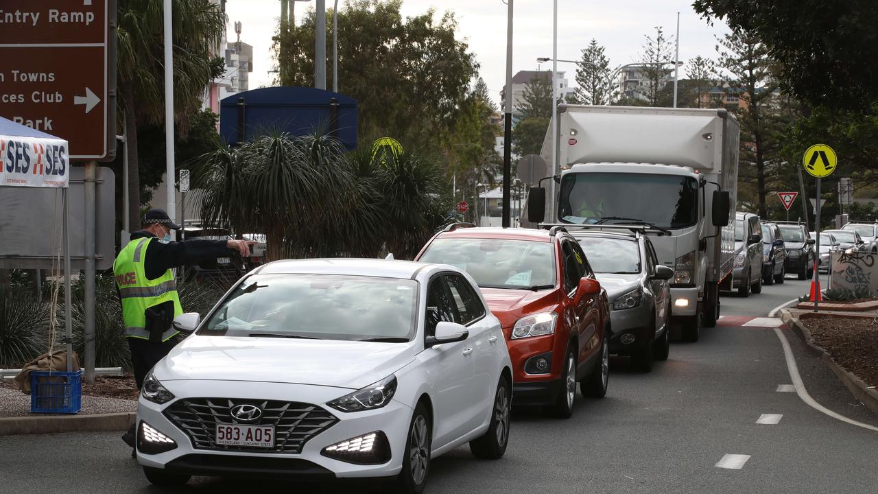 The hard border and long Queues return to the Qld NSW border on the Gold Coast. People getting the thumbs up or turned away in Griffith St Coolangatta. Picture: Glenn Hampson.