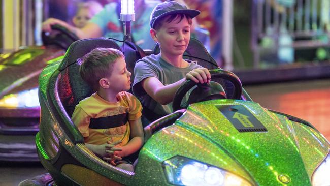 Nova Green and older brother Vincent Green on the dodgem cars at Toowoomba Royal Show, Thursday, March 30, 2023. Picture: Kevin Farmer