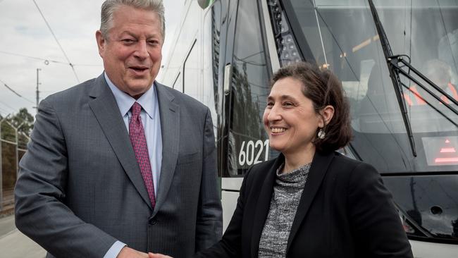 Victorian Energy Minister Lily D'Ambrosio, pictured with former US President Al Gore, says energy consumers won’t bear costs of her plan.