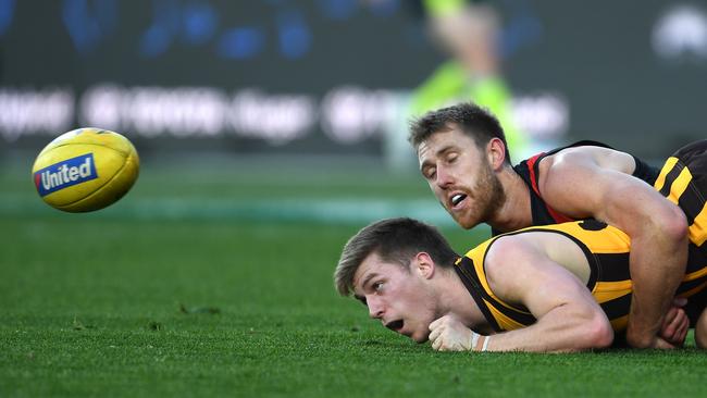 Dyson Heppell brings down Hawk Dylan Moore.