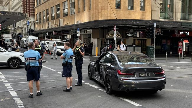 Three teenagers have been arrested after fleeing a BMW with one of its doors ripped off in the city. Picture: Cameron Tandy