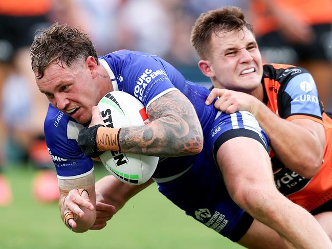 SYDNEY, AUSTRALIA - MAY 04: Kurt Mann of the Bulldogs scores a try during the round nine NRL match between Canterbury Bulldogs and Wests Tigers at Accor Stadium, on May 04, 2024, in Sydney, Australia. (Photo by Brendon Thorne/Getty Images)