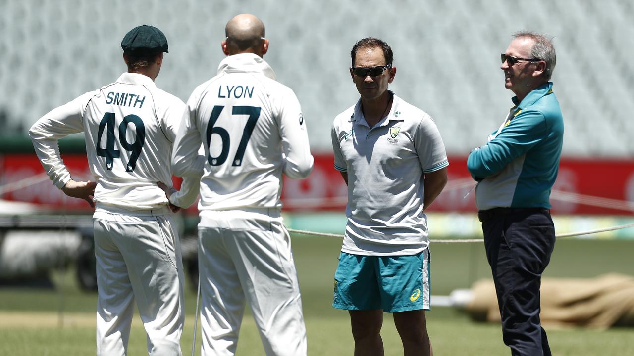 Steve Smith (left), Nathan Lyon, Australia coach Justin Langer and chairman of selectors Trevor Hohns caught up in the middle at Adelaide Oval on Tuesday. Picture: Getty Images