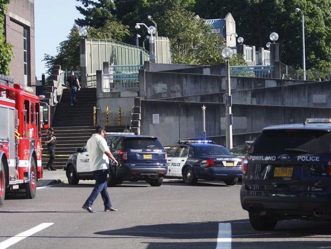 Police in Oregon say two people died and another was hurt in a stabbing on a Portland light-rail train after a man yelled racial slurs at two young Muslim women. Picture: AP.