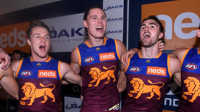 Eric Hipwood of the Lions (centre) sings the team song after Brisbane won the Round 3 AFL match between the Brisbane Lions and Port Adelaide Power at the Gabba in Brisbane, Saturday, April 6, 2019. (AAP Image/Dave Hunt) NO ARCHIVING, EDITORIAL USE ONLY