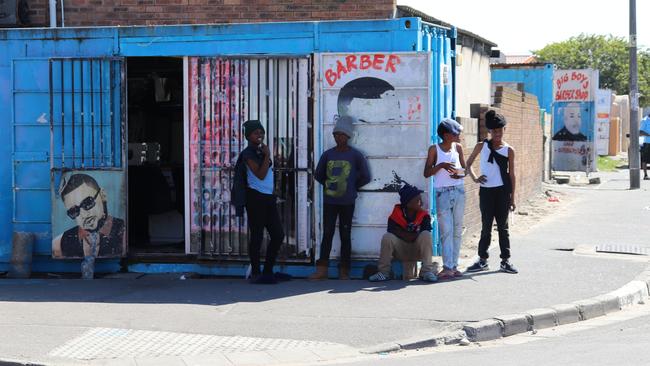 Youths hang out on a street corner in the South African township of Langa. Picture: Megan Palin.