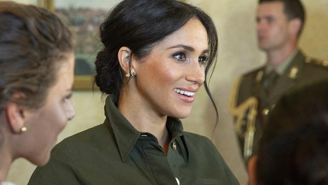 Meghan Markle changed into a stunning green dress. Picture: AP Photo/Steve Christo