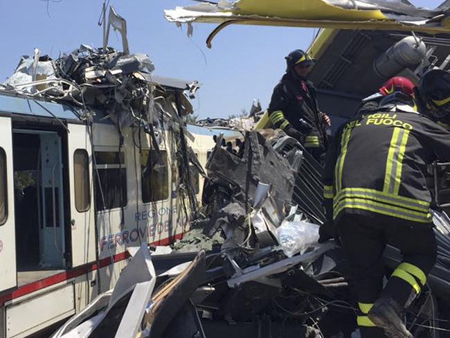 Italian firefighters search among debris at the scene of a train accident after two commuter trains collided head-on near the town of Andria, in the southern region of Puglia.  Picture:  AP