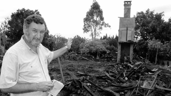 Ipswich Lifeline director the Rev Bob Griffiths at the burnt out Oakdale house in 1990.