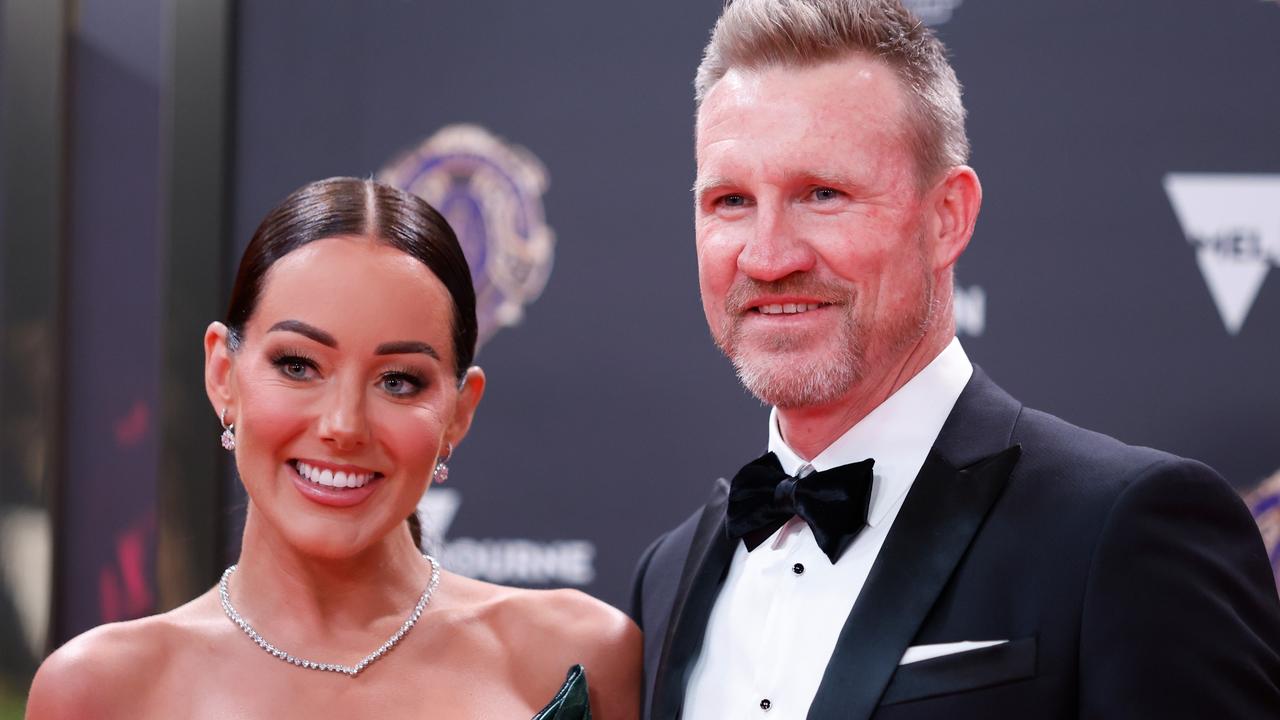 Inside footy glamour couple’s shock split