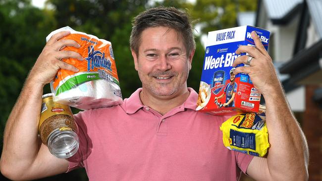 SHOPPING SPREE: Richard Comer, of Greenslopes knos griceries can eat into the household budget. Image: AAP/John Gass