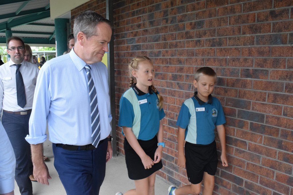 Beaconsfield State School school captains Georgianna Cantwell and Caleb Johns walk Leader of the Opposition Bill Shorten to a prep classroom. Photo: Emily Smith