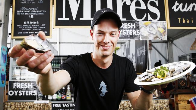 Mures stall supervisor Will Terry with their oysters, which have been their most popular dish at this year’s Taste of Tasmania. Picture: ZAK SIMMONDS