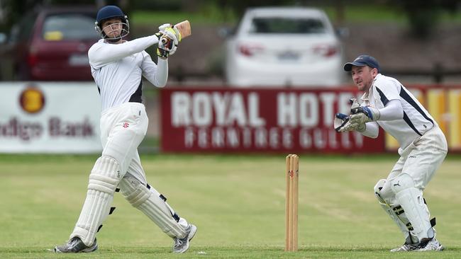 Lysterfield’s Nathan Walsh smashes a six during last summer’s grand final. Picture: Chris Eastman