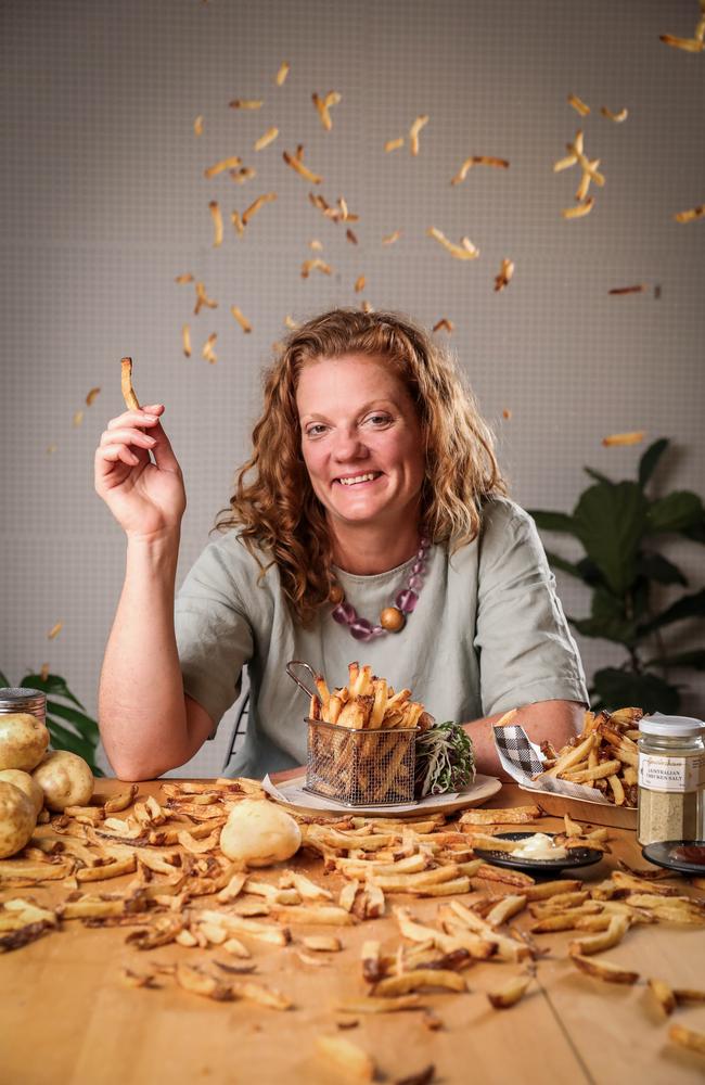 Emma Musgrove from Fred & Ginger is surrounded by spuds as she prepares to cater the Melbourne Food and Wine Festival opening night party, Maximum Chips. Picture: Nicole Cleary