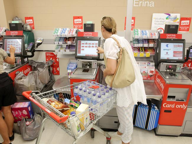 a Customer uses the self serve checkout at Coles Erina - Theft from retail stores across the Coast up about 20% Picture by Mark Scott