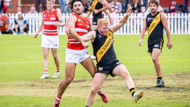 North Adelaide's Lee Minervini and Glenelg's Darcy Bailey become tangled as they fight for the ball at Prospect Oval. Picture: Tom Huntley.