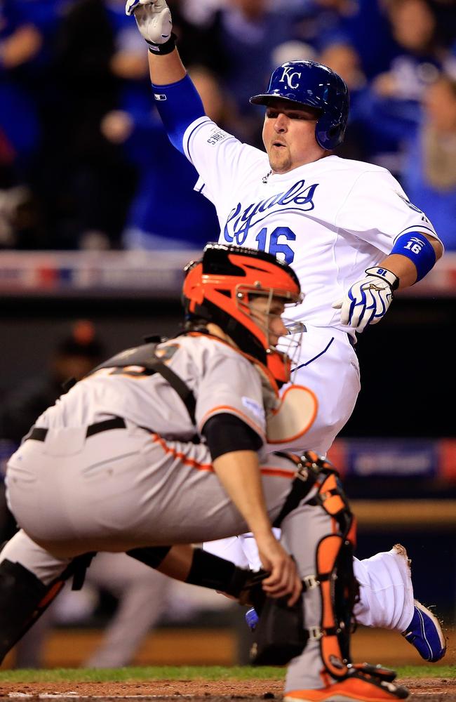 Billy Butler scores for Kansas City in the second inning off a hit by Alex Gordon.