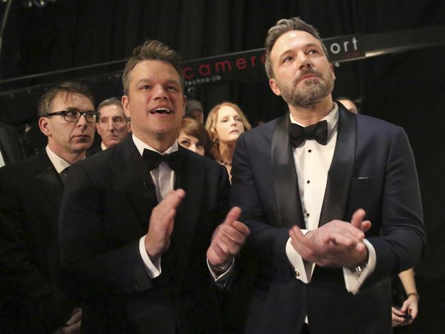 Matt Damon, left, and Ben Affleck appear backstage at the Oscars. Picture: AP