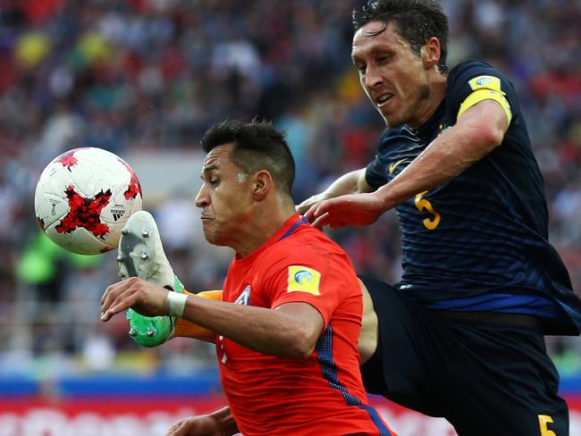 MOSCOW, RUSSIA - JUNE 25: Mark Milligan of Australia fouls Alexis Sanchez of Chile during the FIFA Confederations Cup Russia 2017 Group B match between Chile and Australia at Spartak Stadium on June 25, 2017 in Moscow, Russia.  (Photo by Ian Walton/Getty Images)