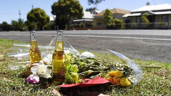 Flowers and a message at the scene of the fatal hit run in South Geelong in 2019. Picture: Alan Barber