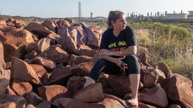 Indigenous woman Raelene Cooper, who is one of the founders of Save Our Songlines, in front of the North West Shelf gas project.