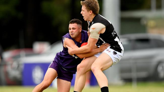 Templestowe’s Dion Mustafa is tackled by Ringwood’s Jacob Bell. Photo by Josh Chadwick