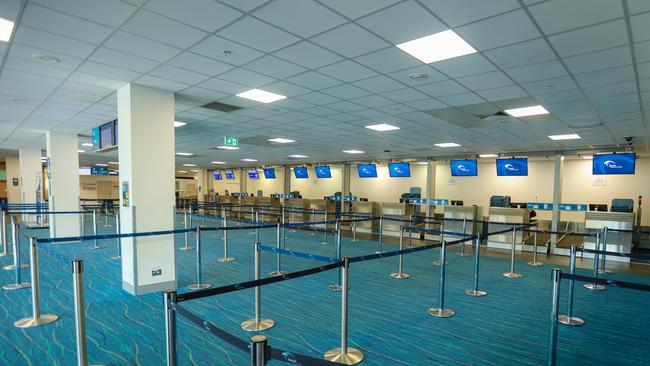 Darwin International Airport has been near empty for most of this week due to coronavirus-related flight cancellations. Picture: Glenn Campbell