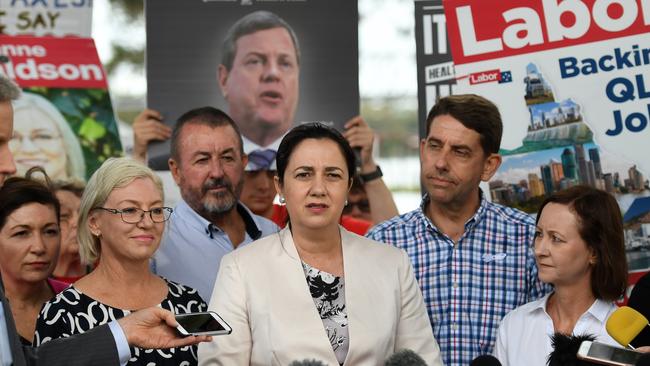 Queensland Premier Annastacia Palaszczuk flanked by Health Minister Cameron Dick, (second right), Attorney General Yvette D'Ath (right) and Member for Bundaberg Leanne Donaldson (third left). Picture: AAP.