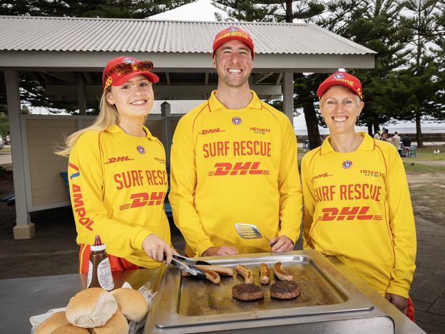 SYDNEY, AUSTRALIA - DAILY TELEGRAPH - 19th October 2024: L-R Aimee Charles, Callum Hawkins and Sarah Flynn all of Coogee SLSC cooking at Coogee beach. They will be  cooking a bbq for the King of England on his visit to the  NSW Community event in Parramatta.Picture: Daily Telegraph / Brendan Read