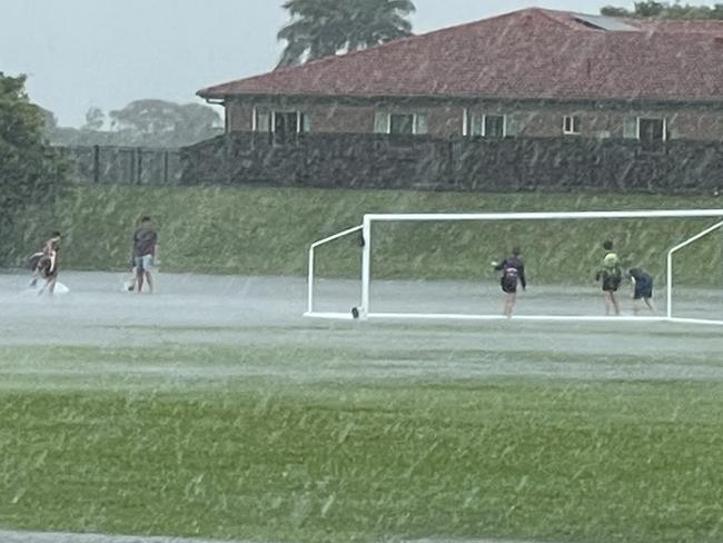 Children came to the Mackay Wanderers FC fields with boogie boards after they flooded overnight. Photo: Fergus Gregg