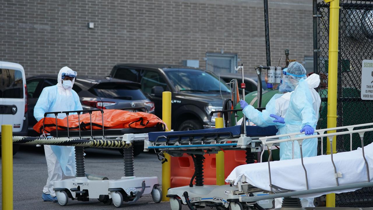 Bodies are moved to a refrigerator truck serving as a temporary morgue outside of Wyckoff Hospital. Picture: Bryan R. Smith/AFP