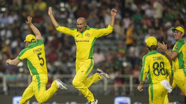 Australia's bowler Ashton Agar, second from left, celebrates with teammates after dismissing South Africa's batsman Dale Steyn during the 1st T20 cricket match between South Africa and Australia at Wanderers stadium in Johannesburg, South Africa, Friday, Feb. 21, 2020. (AP Photo/Themba Hadebe)