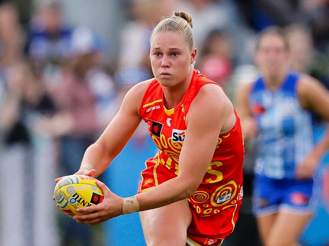 MELBOURNE, AUSTRALIA - NOVEMBER 02: Charlie Rowbottom of the Suns runs with the ball during the 2024 AFLW Round 10 match between the North Melbourne Tasmanian Kangaroos and the Gold Coast Suns at Arden Street Oval on November 02, 2024 in Melbourne, Australia. (Photo by Dylan Burns/AFL Photos via Getty Images)