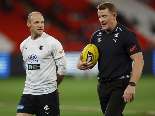 Andrew Russell shares some thoughts with head coach Michael Voss. Picture: Michael Klein