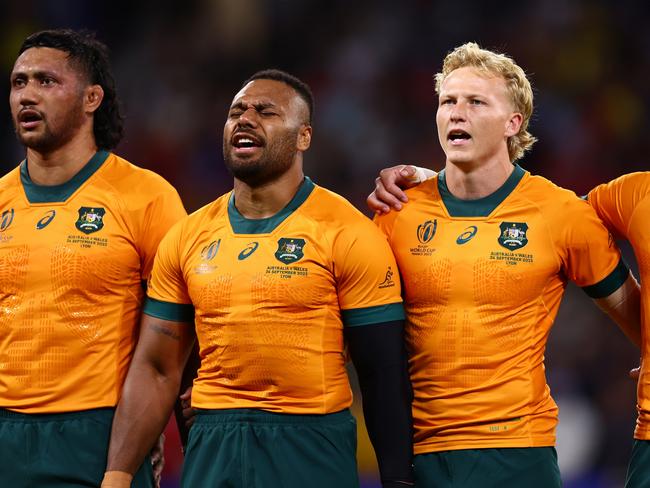 LYON, FRANCE - SEPTEMBER 24: Robert Leota, Samu Kerevi, Carter Gordon, Mark Nawaqanitawase of Australia line up during the National Anthems prior to the Rugby World Cup France 2023 match between Wales and Australia at Parc Olympique on September 24, 2023 in Lyon, France. (Photo by Chris Hyde/Getty Images)