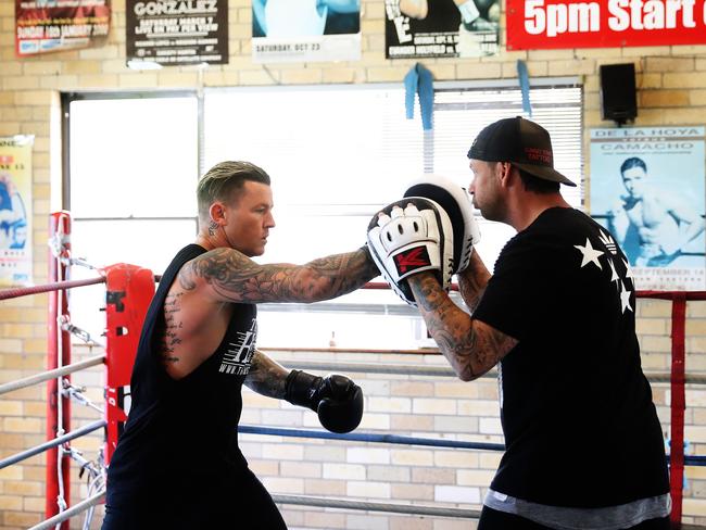 Todd Carney prepares for his boxing debut with trainer Mark Gambin at Tszyu Boxing Academy. Picture: Brett Costello